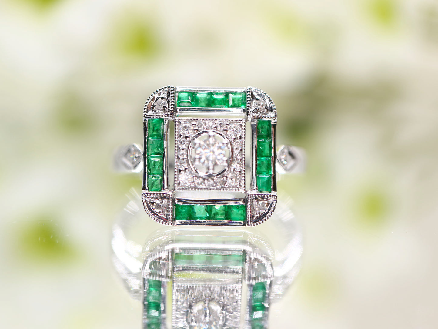 Art deco emerald ring in square channel set design