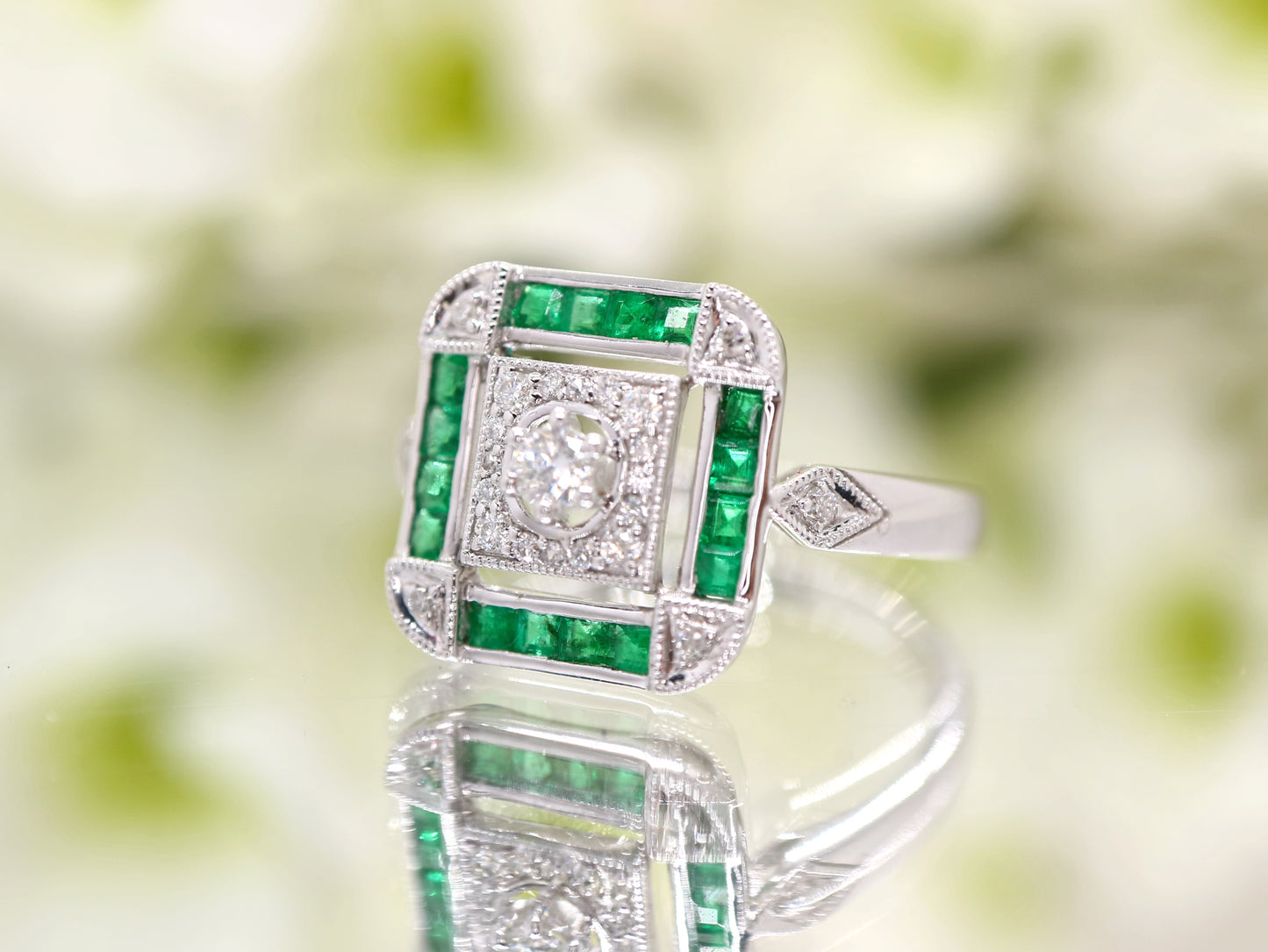 Art deco emerald ring in square channel set design