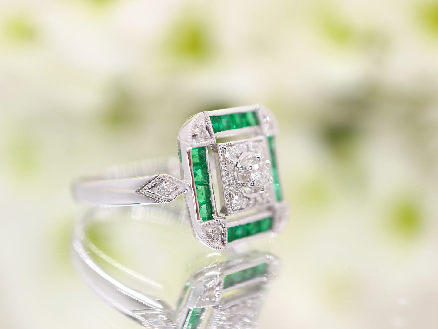 Art deco emerald ring in square channel set design