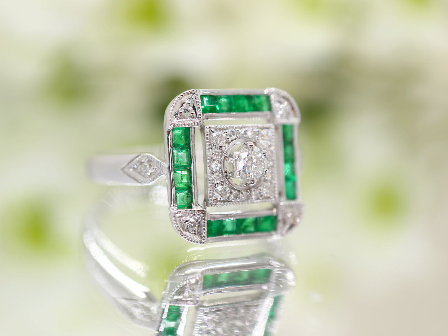 Art deco emerald ring in square channel set design