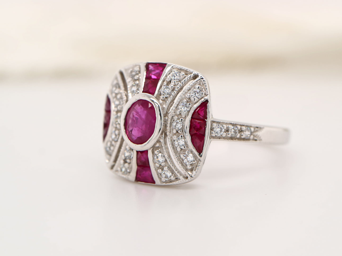 Art deco ruby ring in classic cushion design