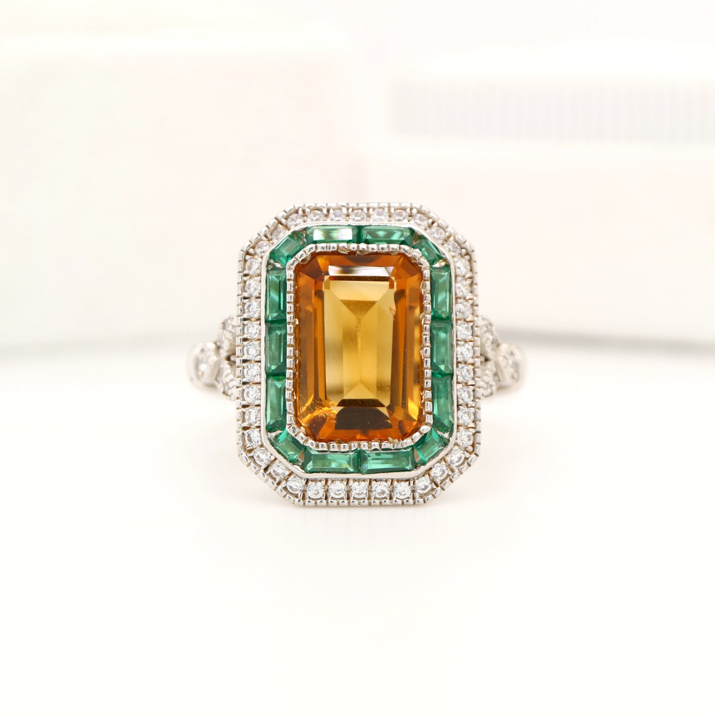 Art Deco style channel set ring with citrine and emerald