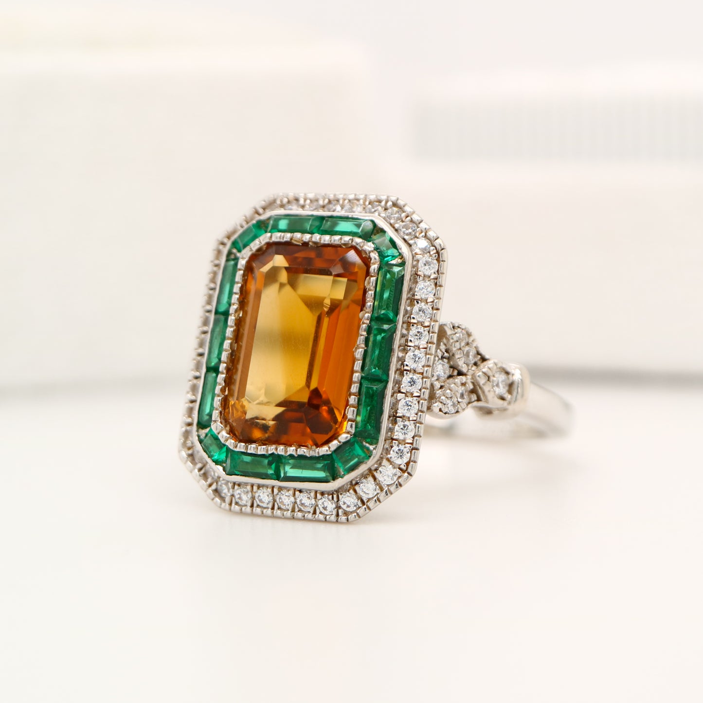 Art Deco style channel set ring with citrine and emerald