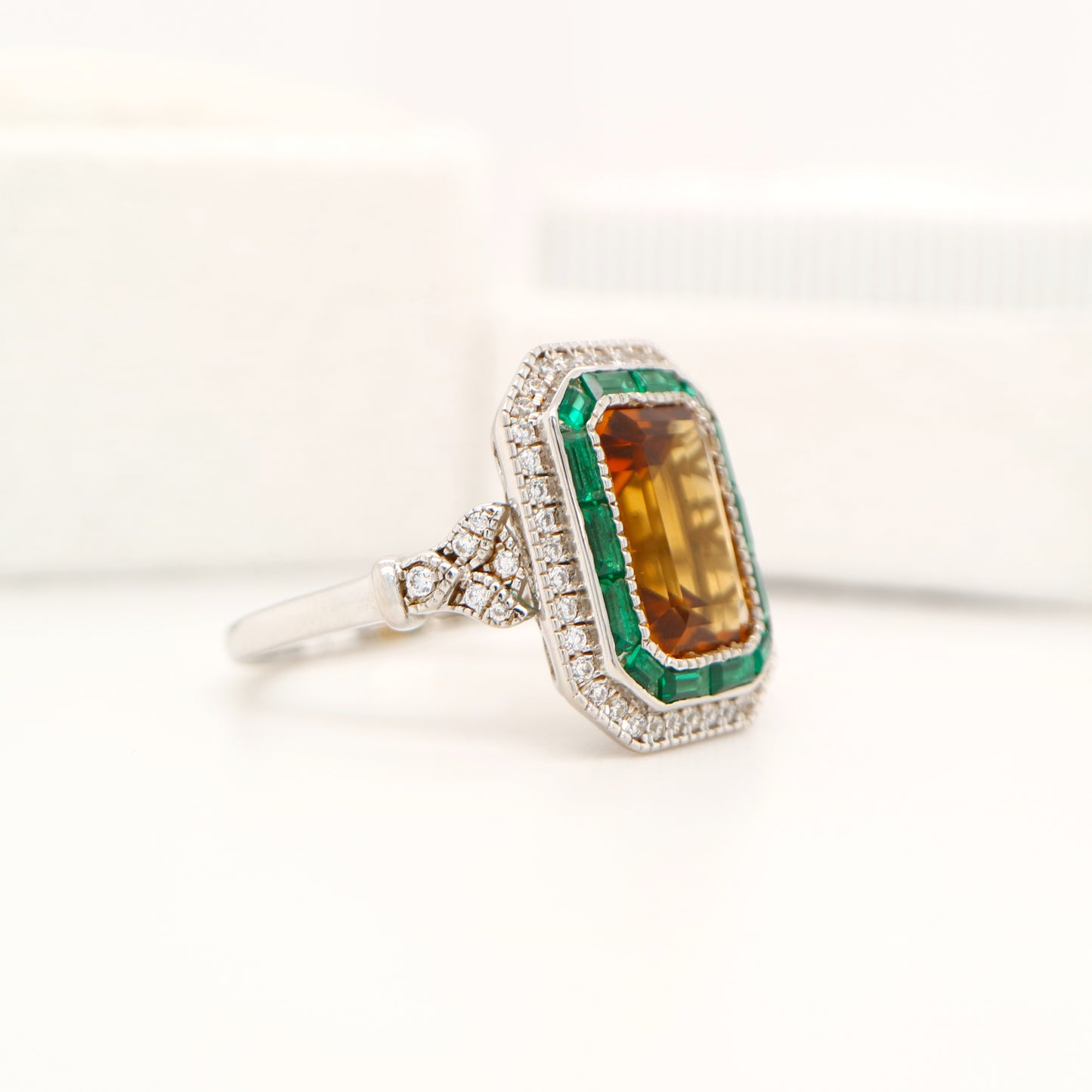 Art Deco style channel set ring with citrine and emerald