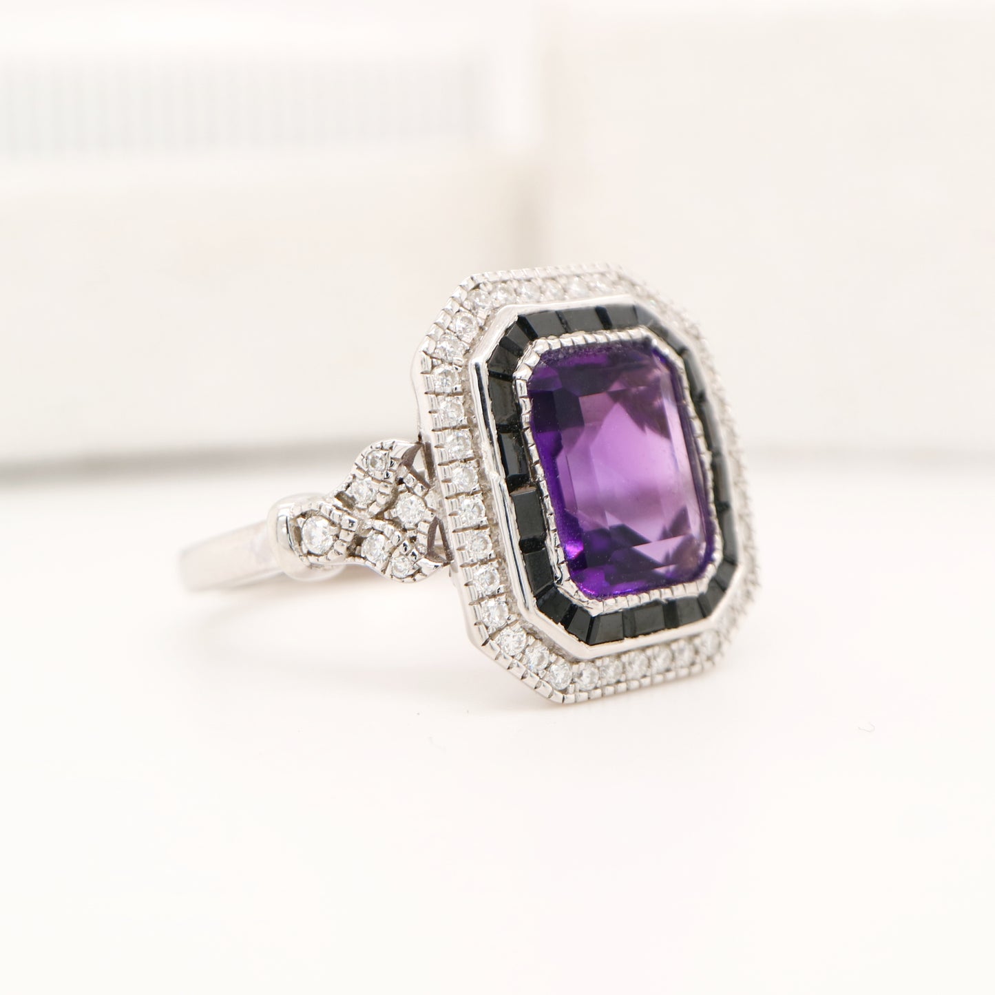 Art deco style amethyst ring with black onyx channel set halo