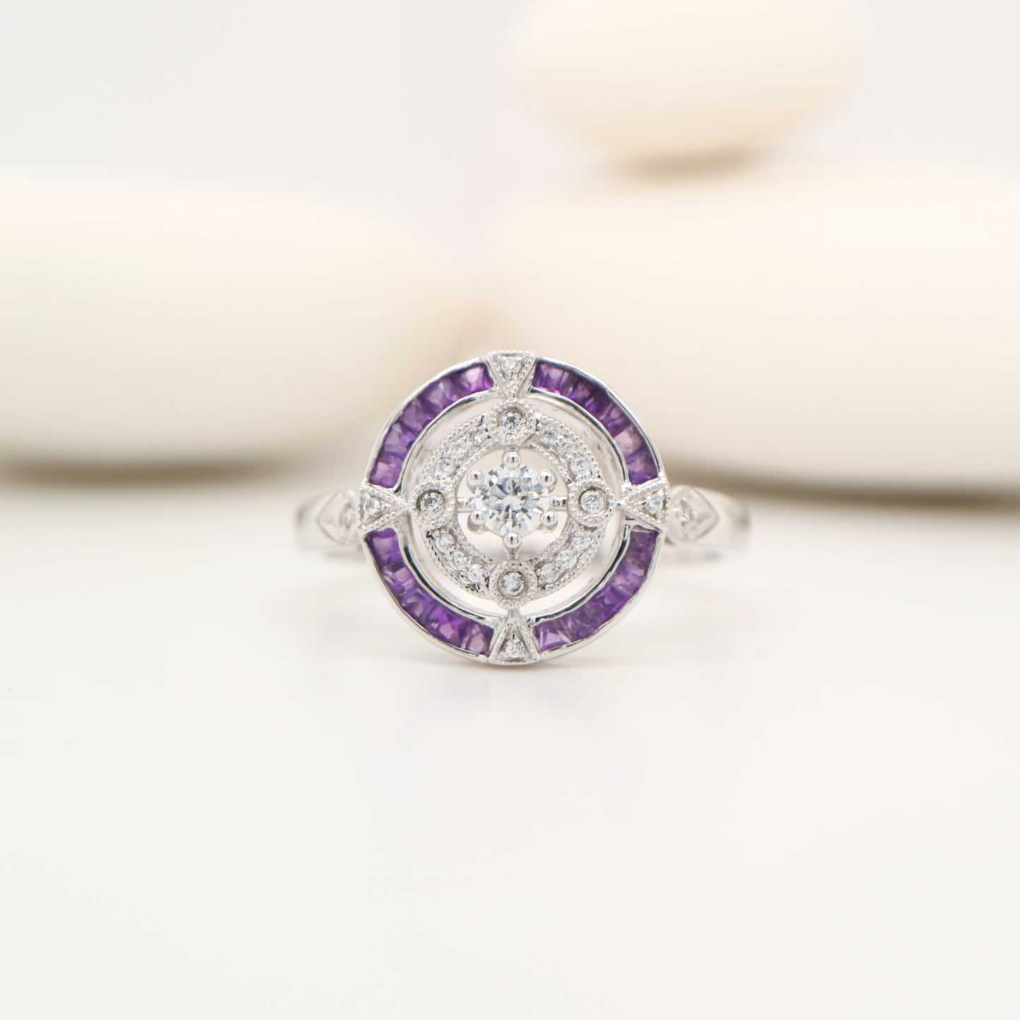 Art Deco inspired white gold ring with diamond and amethyst halo