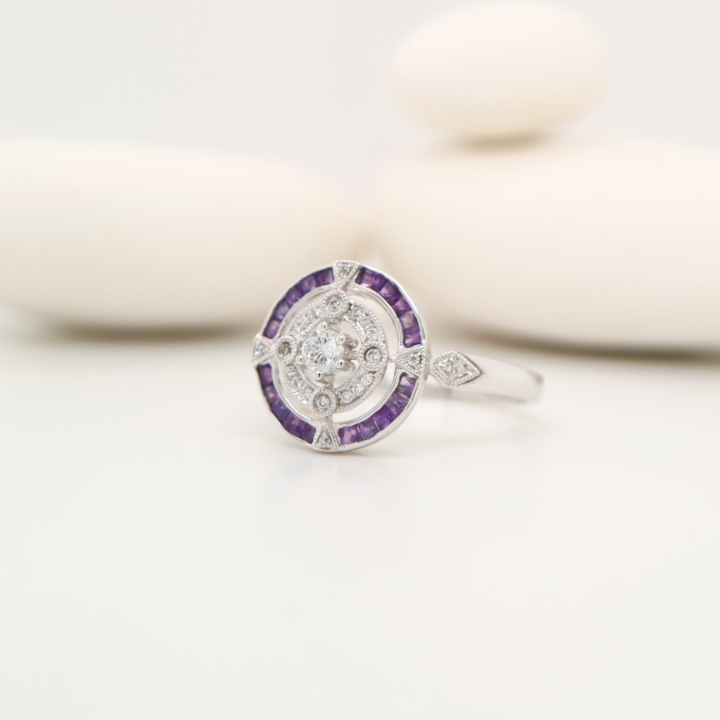 Art Deco inspired white gold ring with diamond and amethyst halo