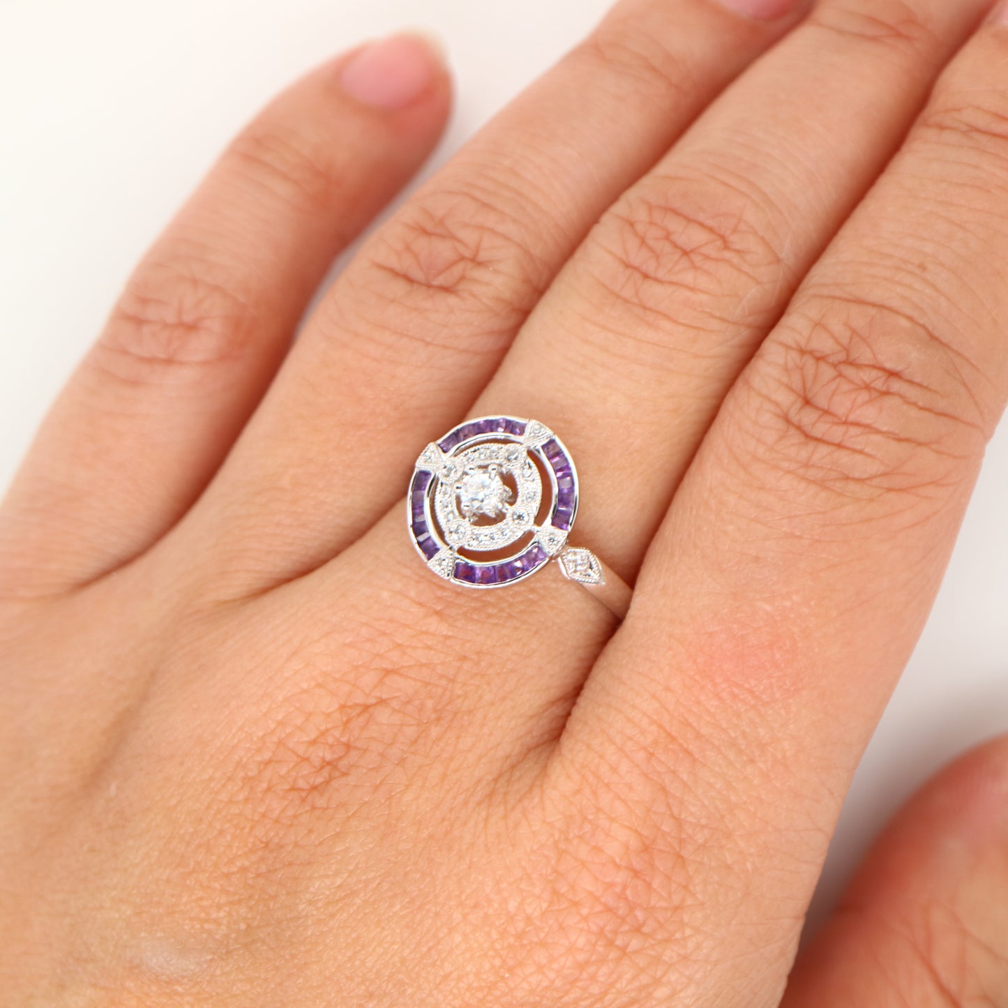 Art Deco inspired white gold ring with diamond and amethyst halo