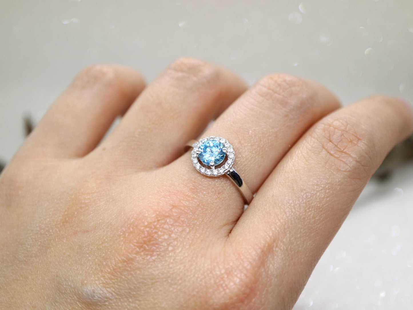 Blue topaz classic halo ring