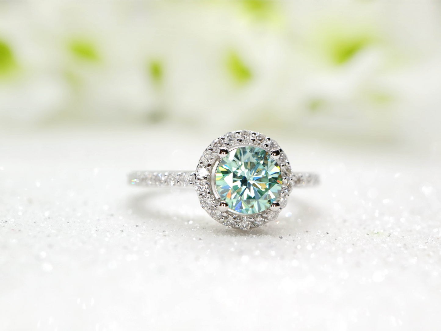 Minty green moissanite and diamond halo ring