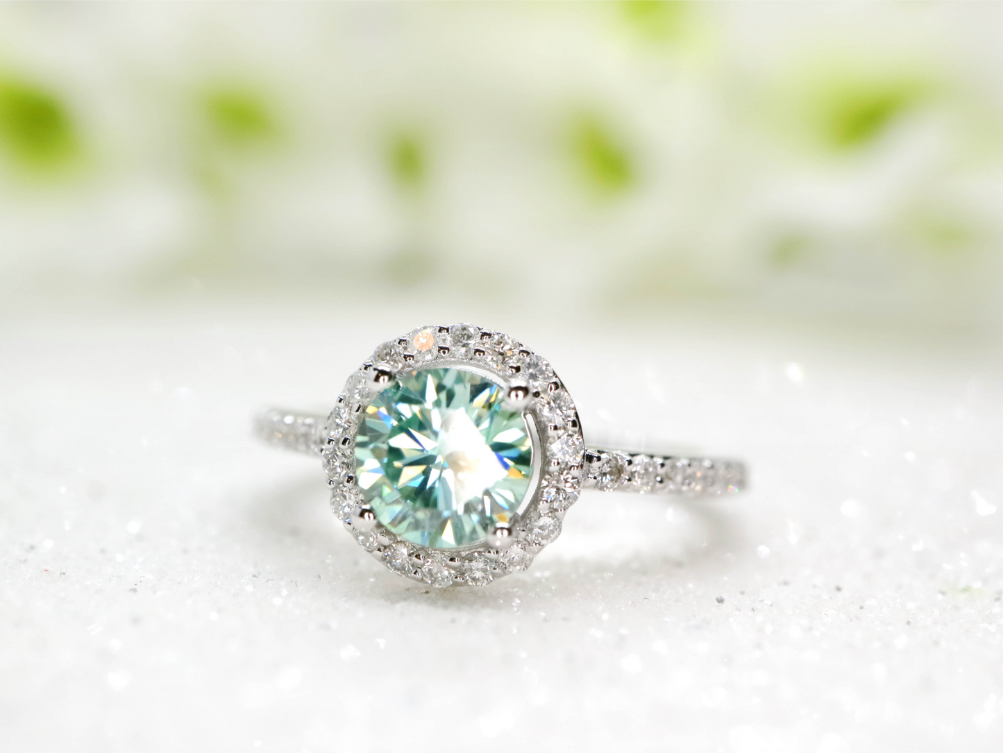 Minty green moissanite and diamond halo ring