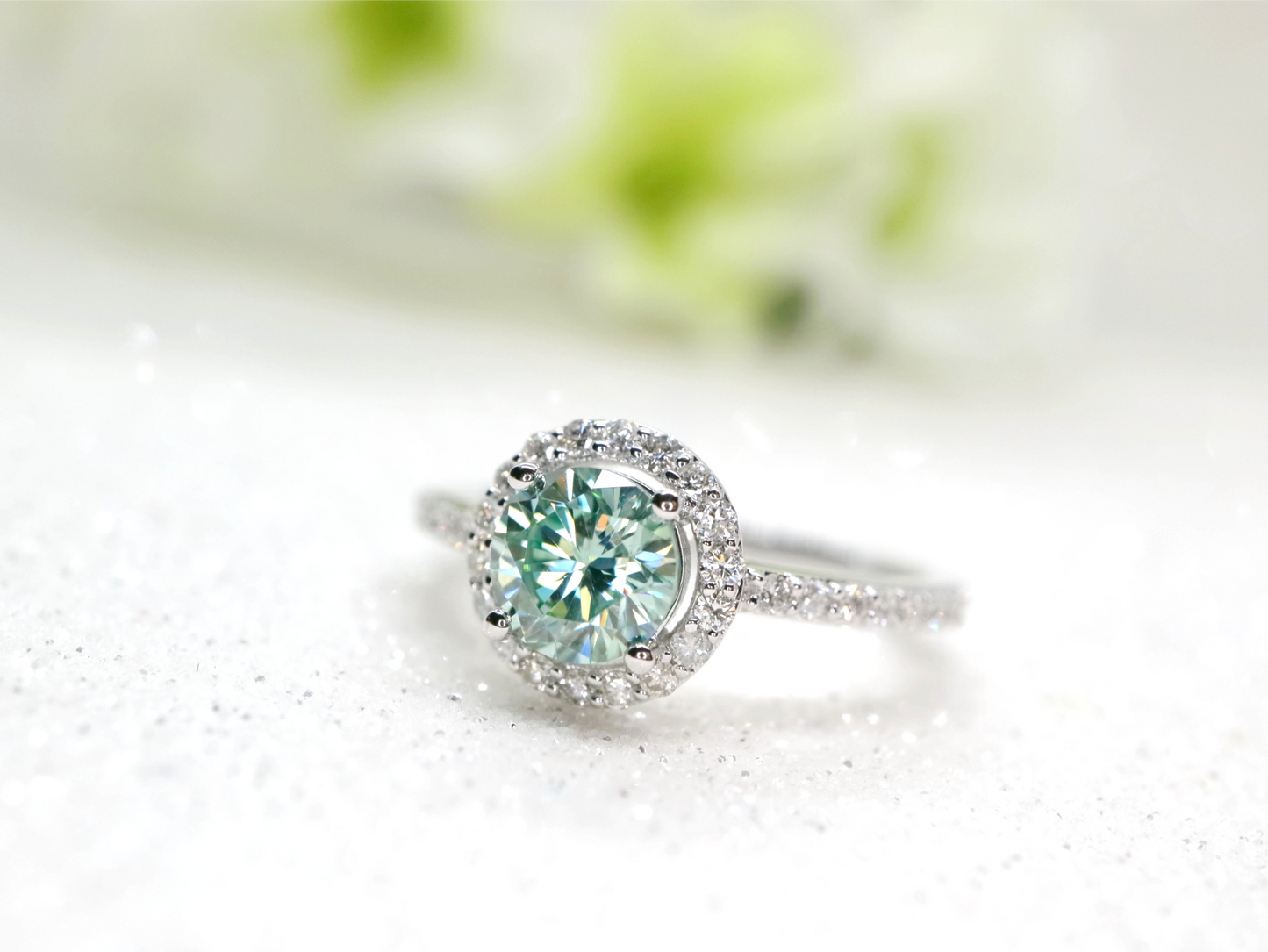 Minty green moissanite and diamond halo ring