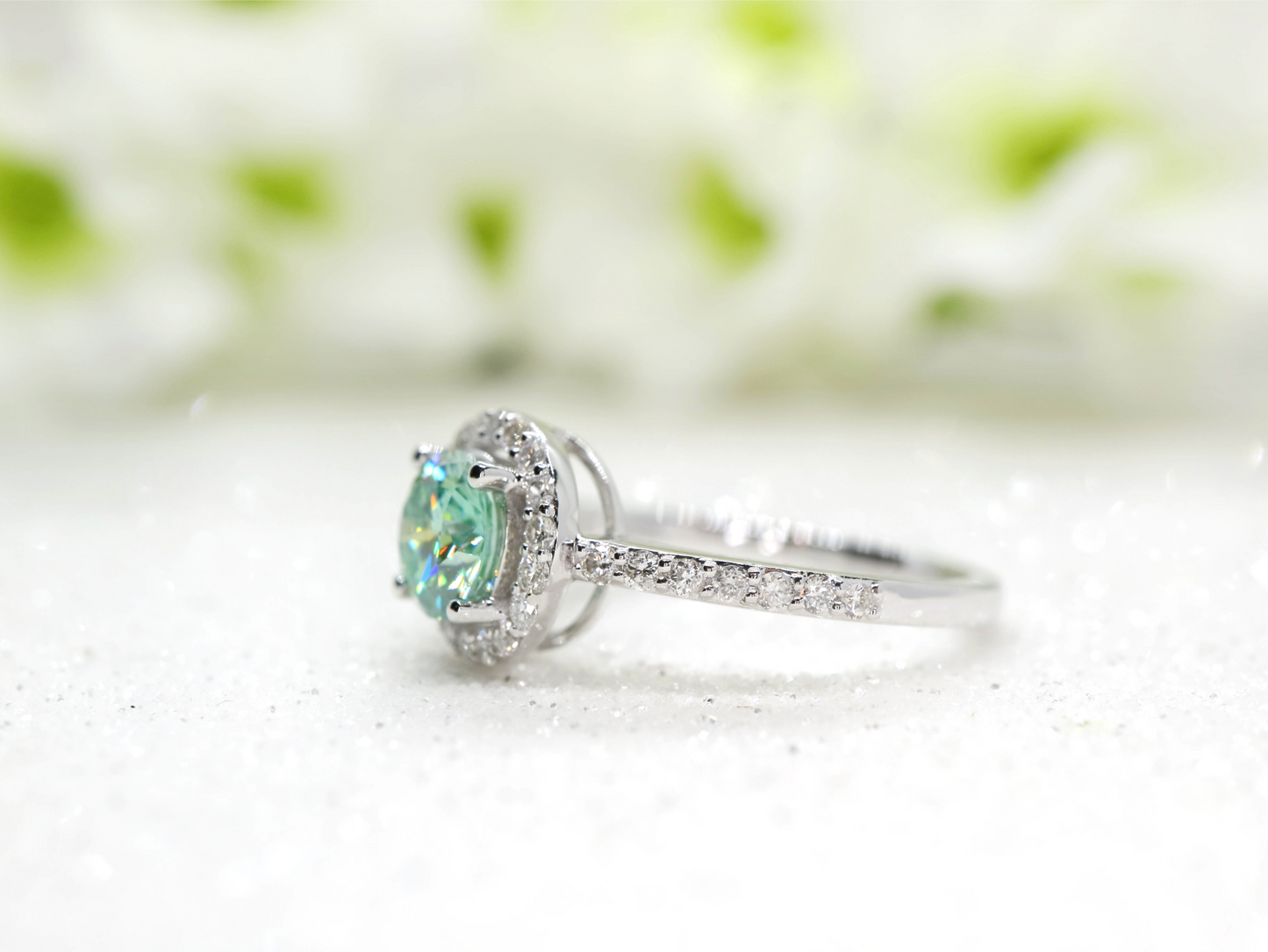 Minty green moissanite and diamond halo ring