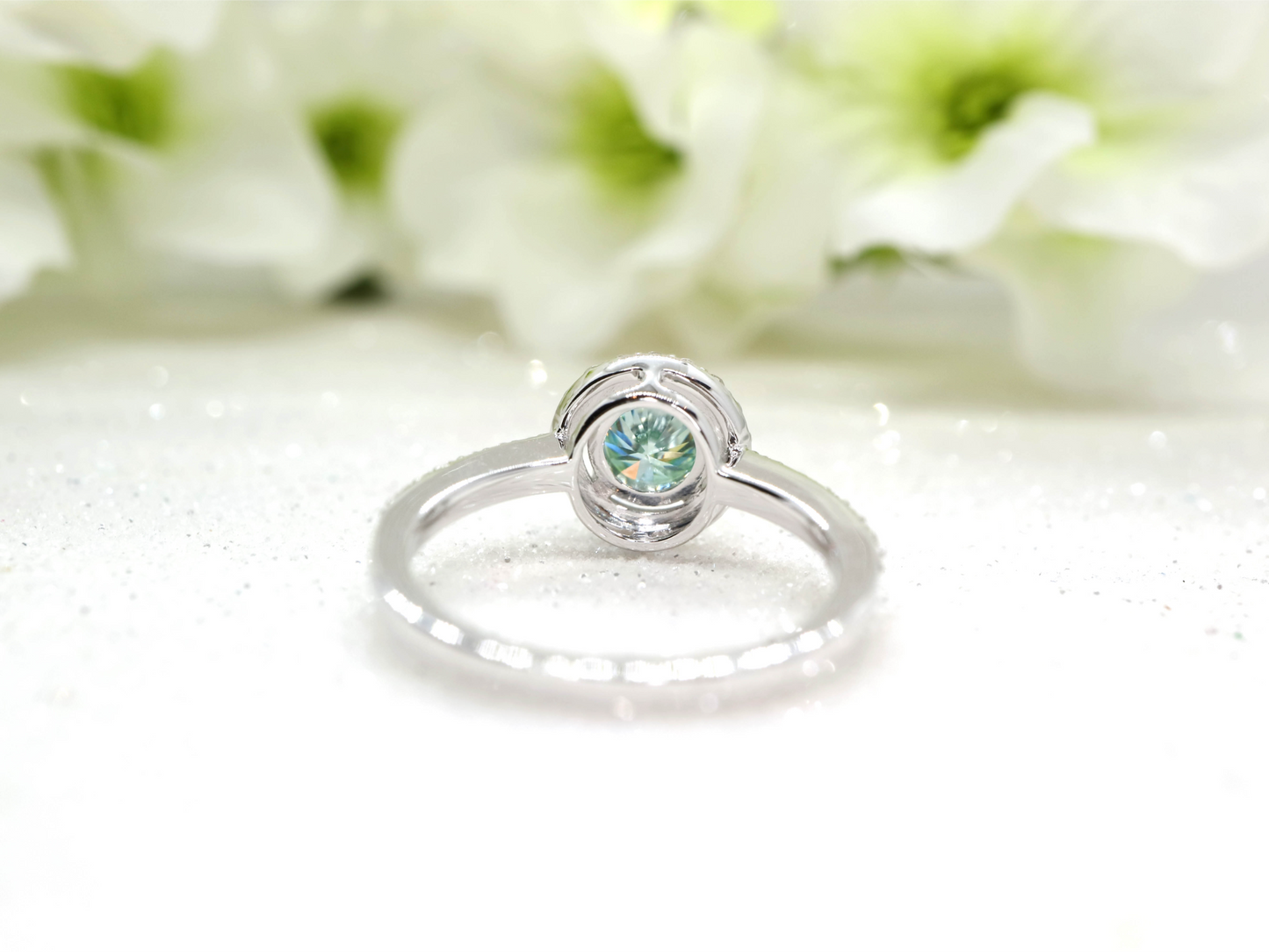 Minty green moissanite and diamond halo ring