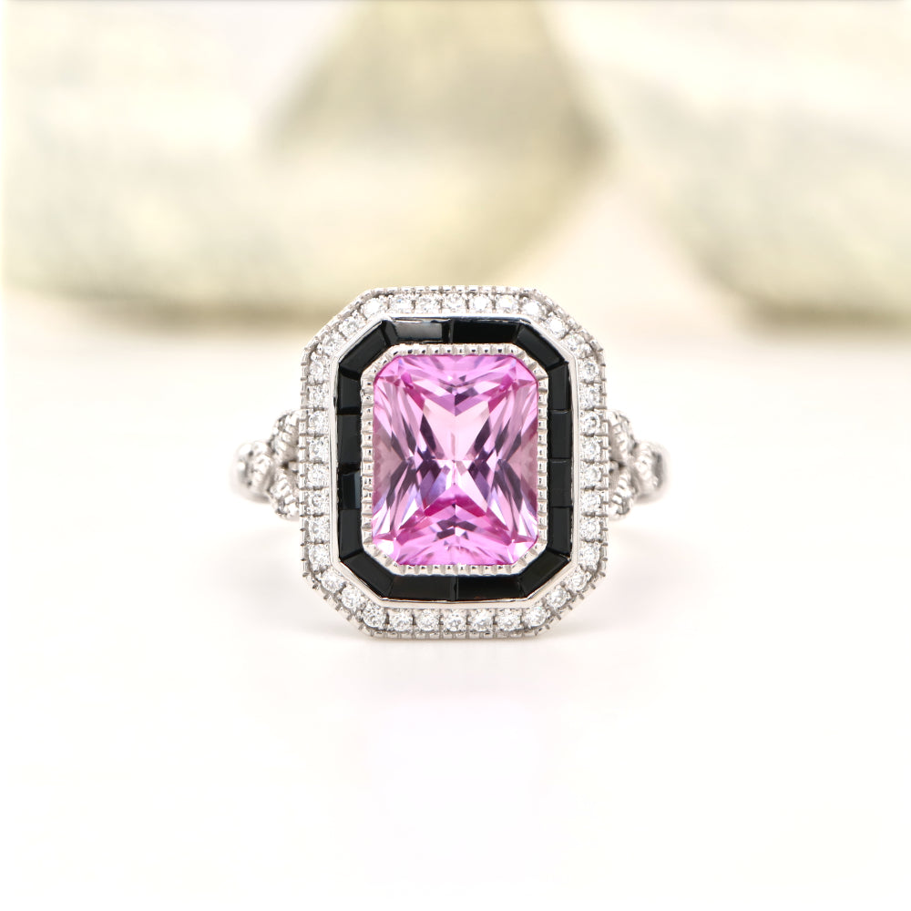 Art deco style pink sapphire ring with black onyx channel set halo