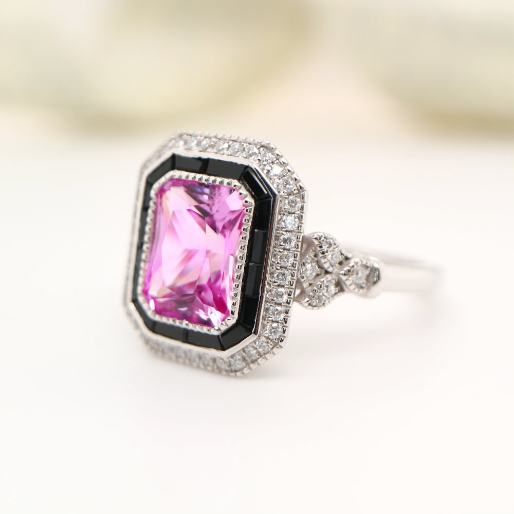 Art deco style pink sapphire ring with black onyx channel set halo