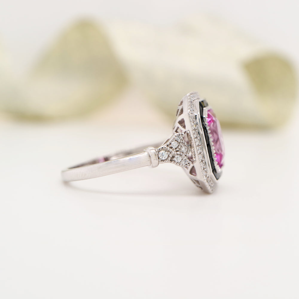 Art deco style pink sapphire ring with black onyx channel set halo