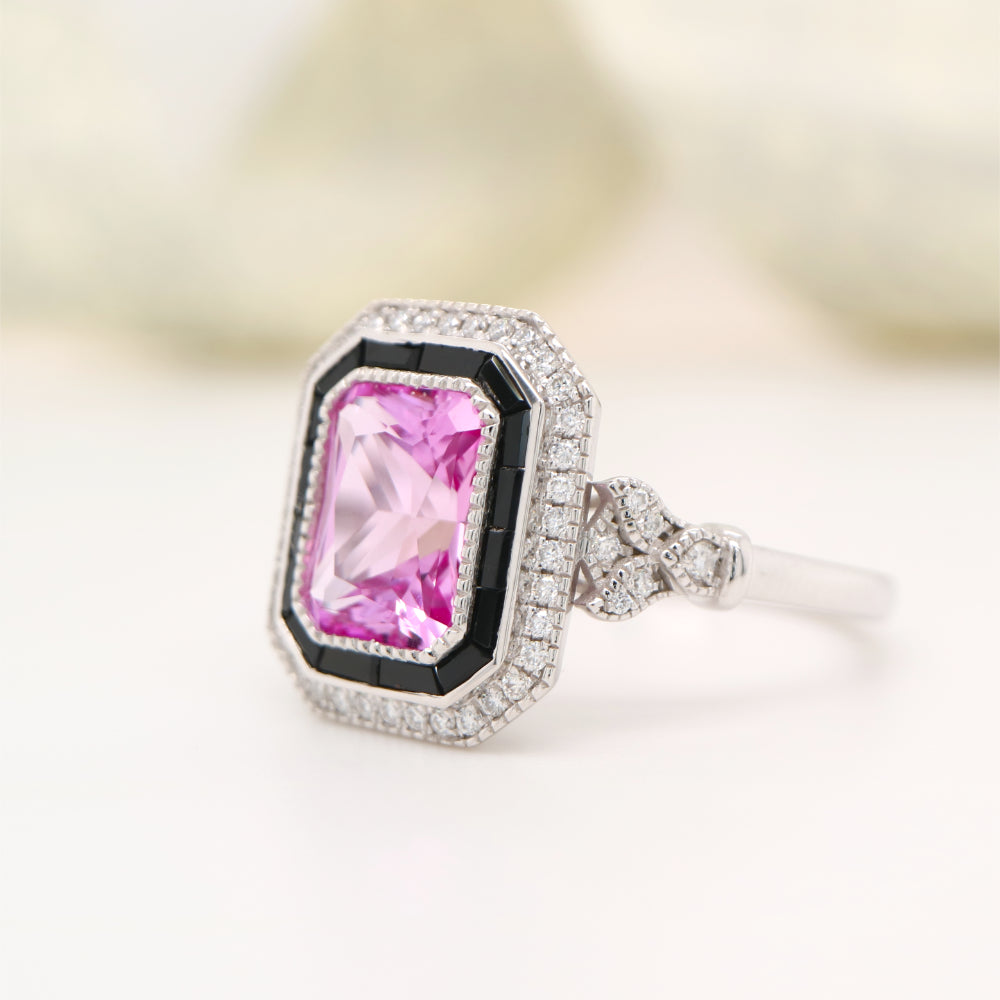 Art deco style pink sapphire ring with black onyx channel set halo