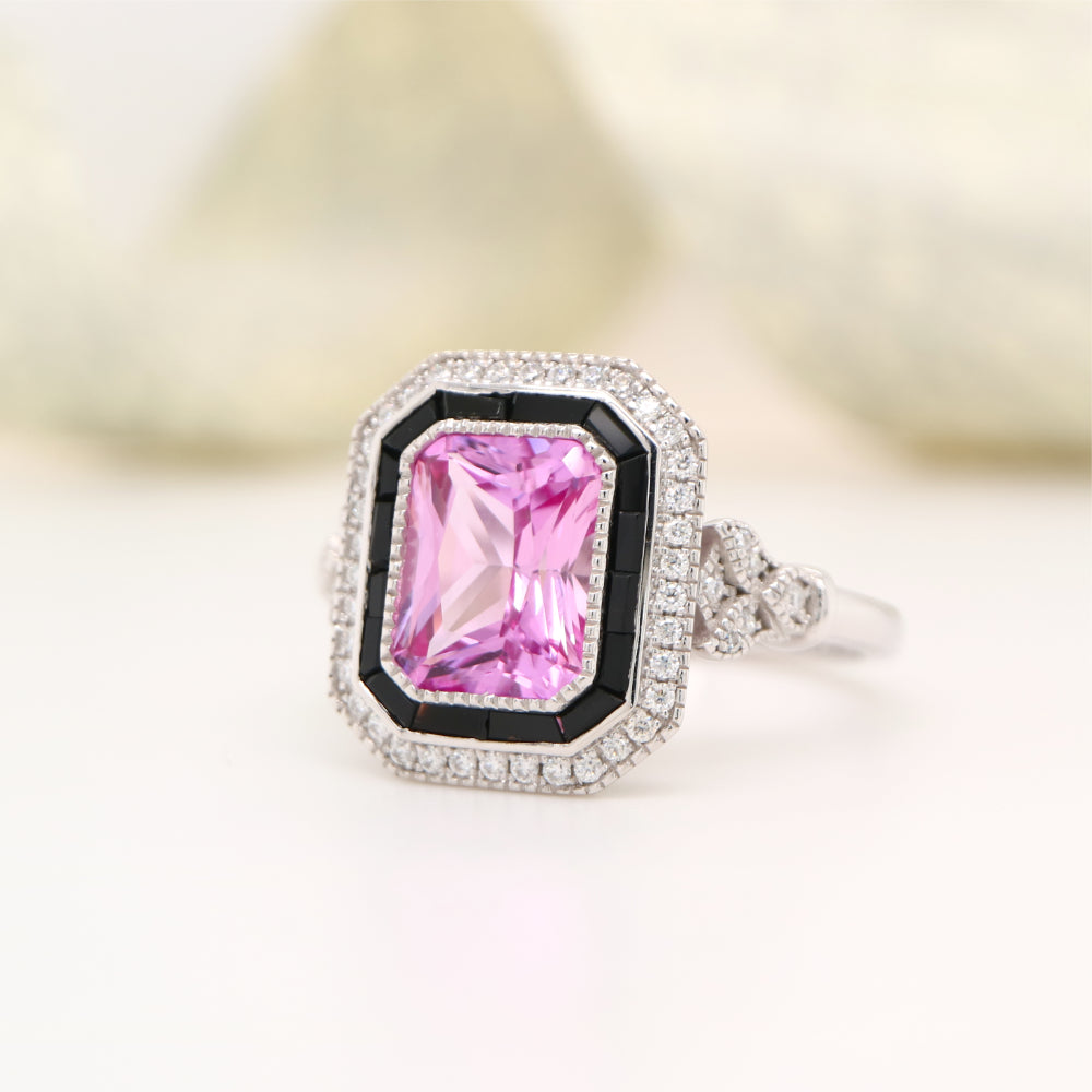 Art deco style pink sapphire ring with black onyx channel set halo