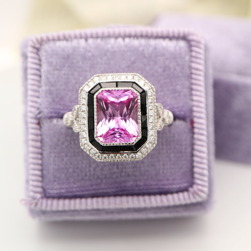 Art deco style pink sapphire ring with black onyx channel set halo